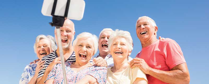 A group of Seniors smiling for a selfie