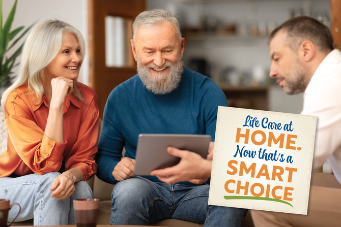 Three adults are sitting and looking at a tablet. A sign in the foreground reads, "Life Care at Home. Now that's a smart choice.